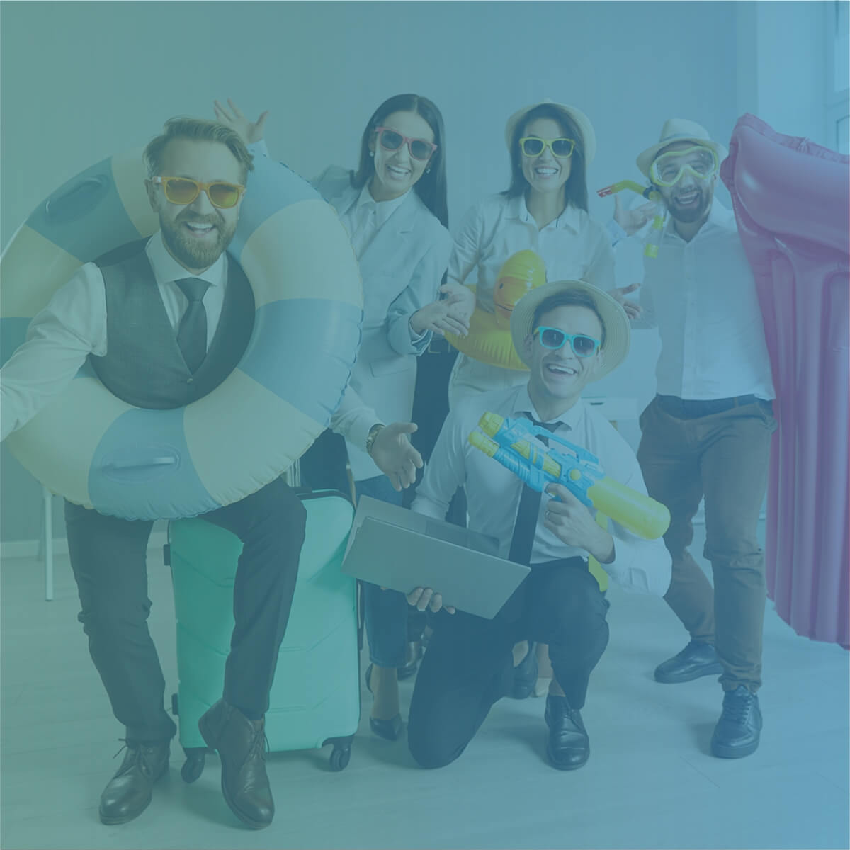 Recruitment professionals in office attire celebrating with summer holiday props and inflatables.