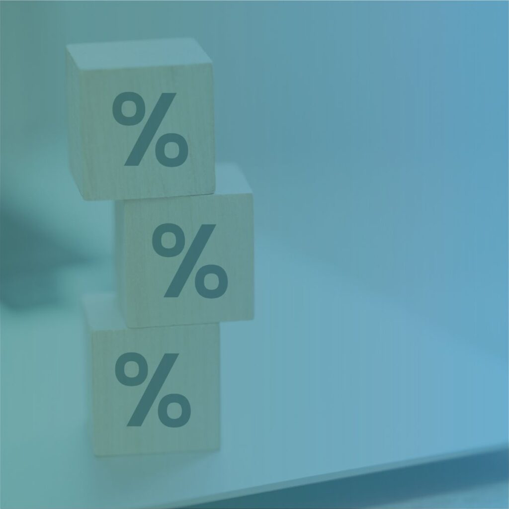 Wooden blocks with percentage signs representing markup vs margin calculations for recruitment agencies.